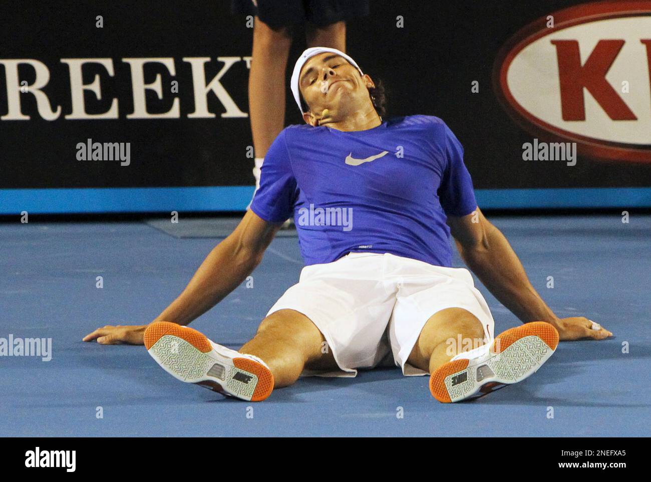 Rafael Nadal of Spain sits on the court during an exhibition tennis match  in Melbourne, Australia, Sunday Jan. 17, 2010. A series of exhibition games  were set up by Roger Federer of