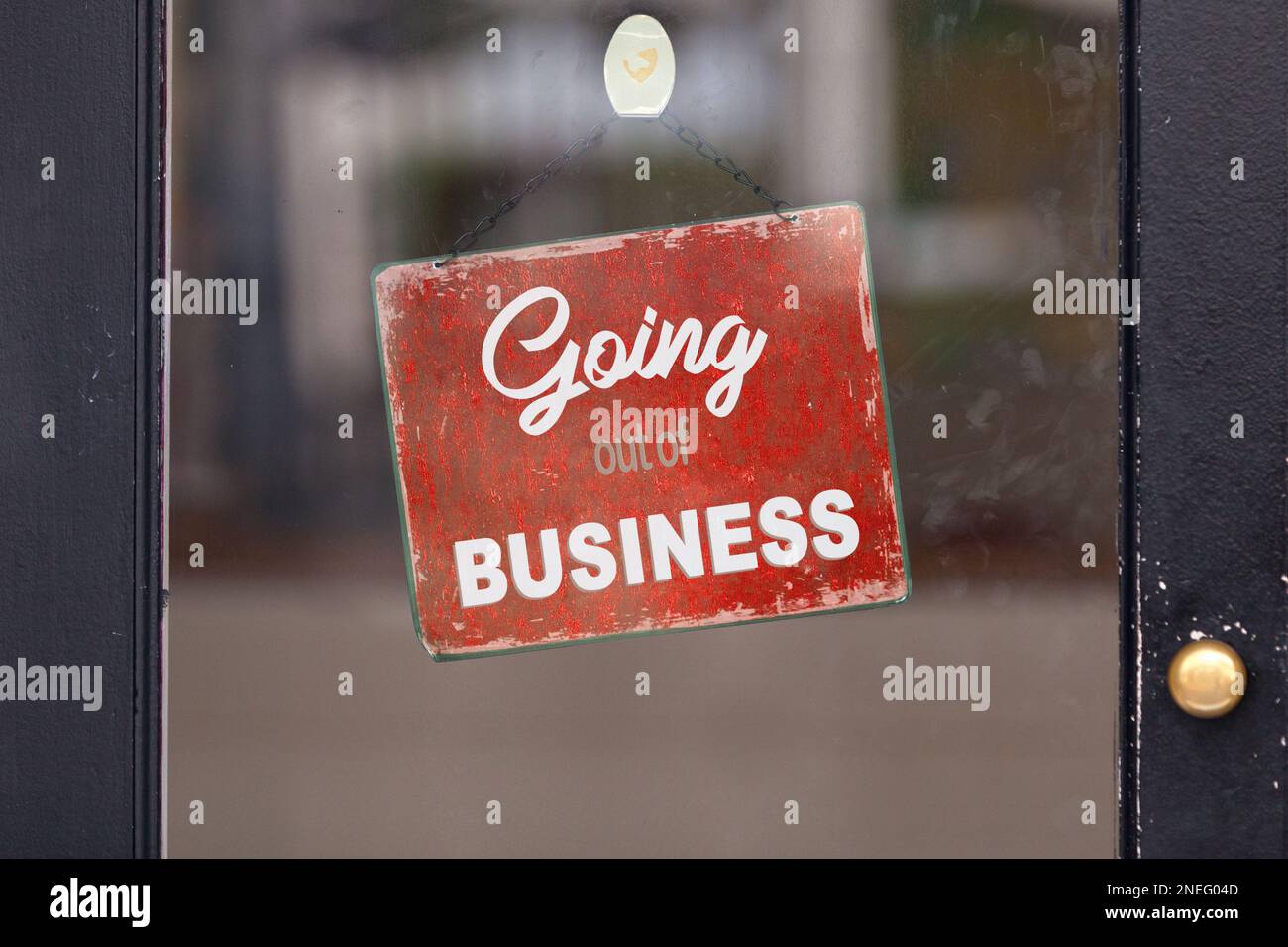 Red closed sign with written in it: 'Going out of business'. Stock Photo