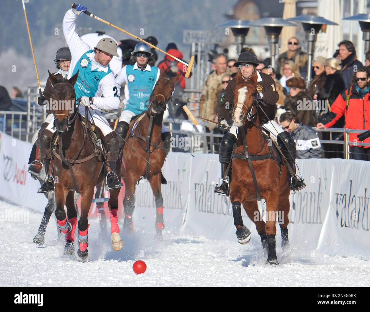 German actor Heino Ferch, right, and Sven Schneider, left, challenge for  the ball during their match in the Snow Arena Polo World Cup in Kitzbuehel,  Austria, Friday, Jan 15, 2010. (AP Photo/