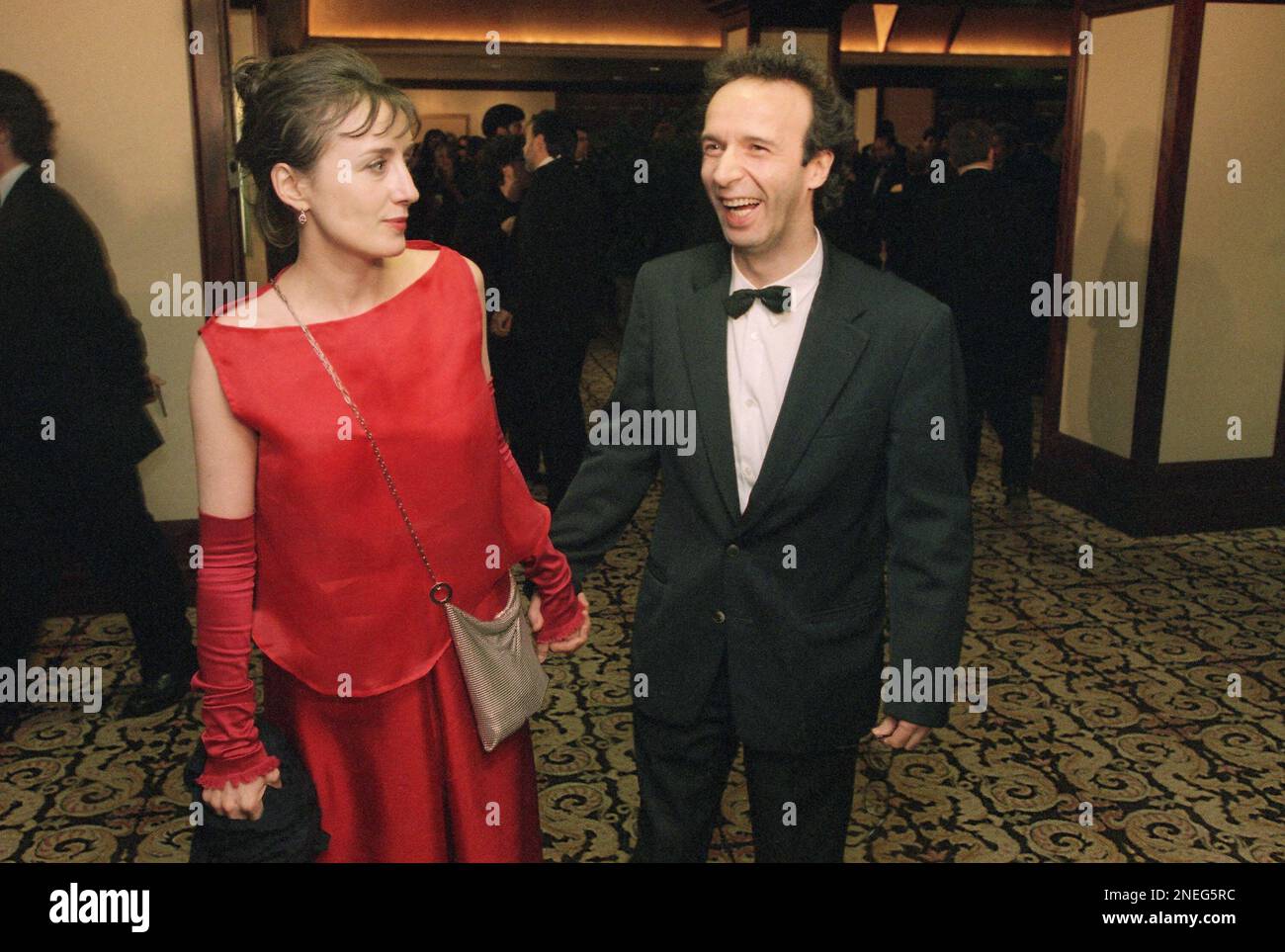 ?Life is Beautiful? director Roberto Benigni, with his wife, actress