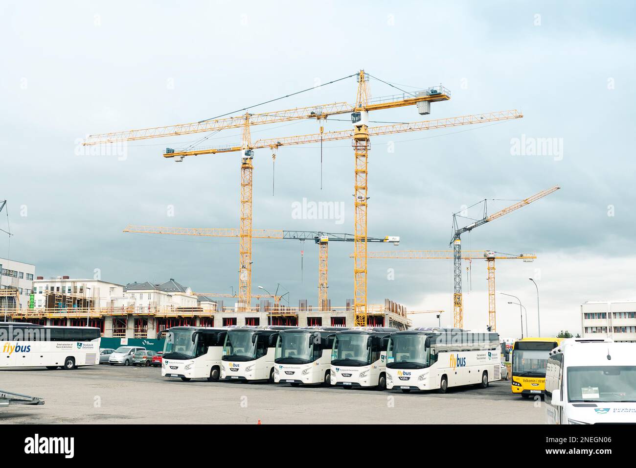 Reykjavik, Iceland - July 12 2022: Bus station in Reykjavik with construction site behind and many cranes Stock Photo