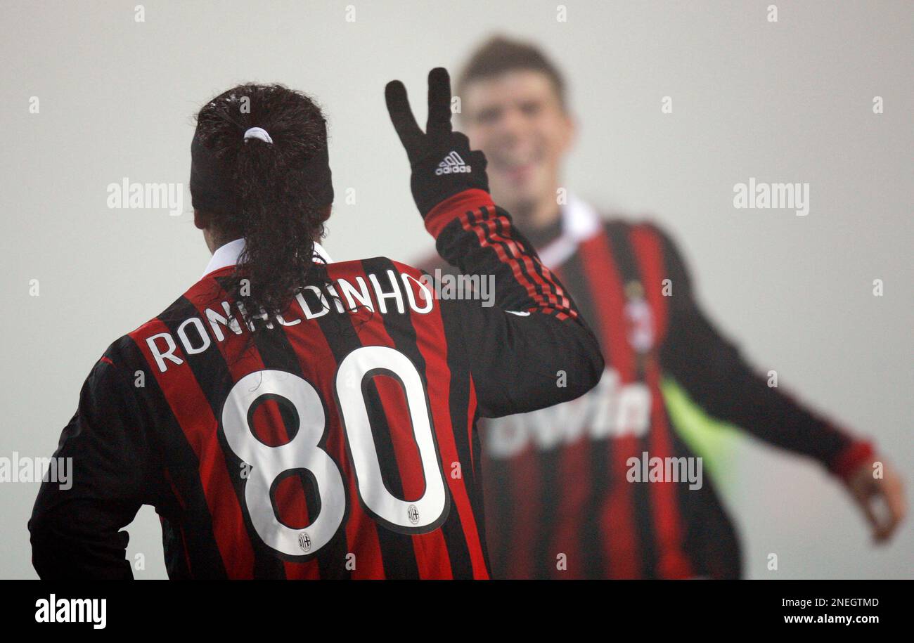 AC Milan Brazilian forward Ronaldinho back to camera n. 80 celebrates after scoring his second goal during the Serie A soccer match between Juventus and AC Milan at the Olympic stadium