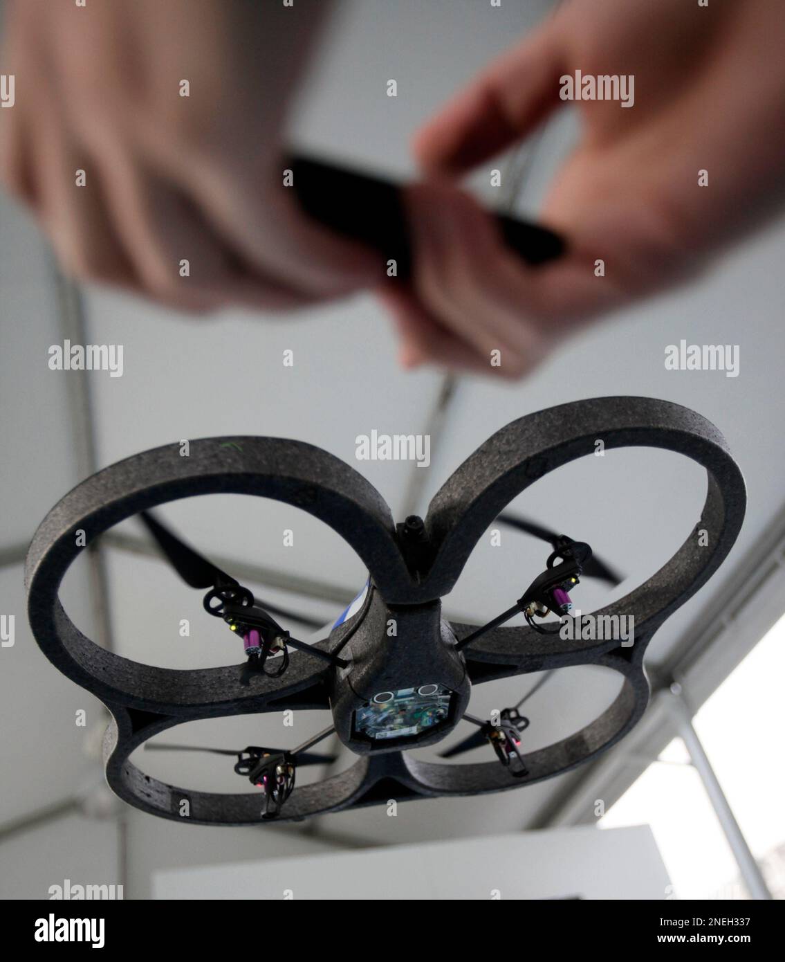 A Parrot A.R. Drone, the four-propeller flying drone that connects to an  Apple iPhone or iPod Touch via Wi-Fi with a video-streaming camera, hovers  at the Consumer Electronics Show (CES) in Las