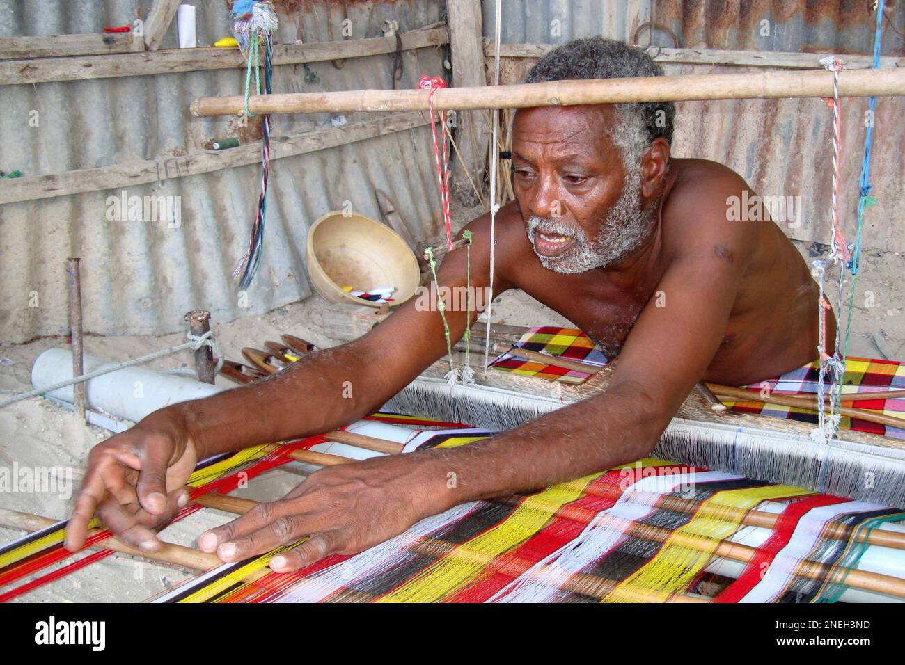 A Somali man from the Benadiri ethnic group makes traditional cloth