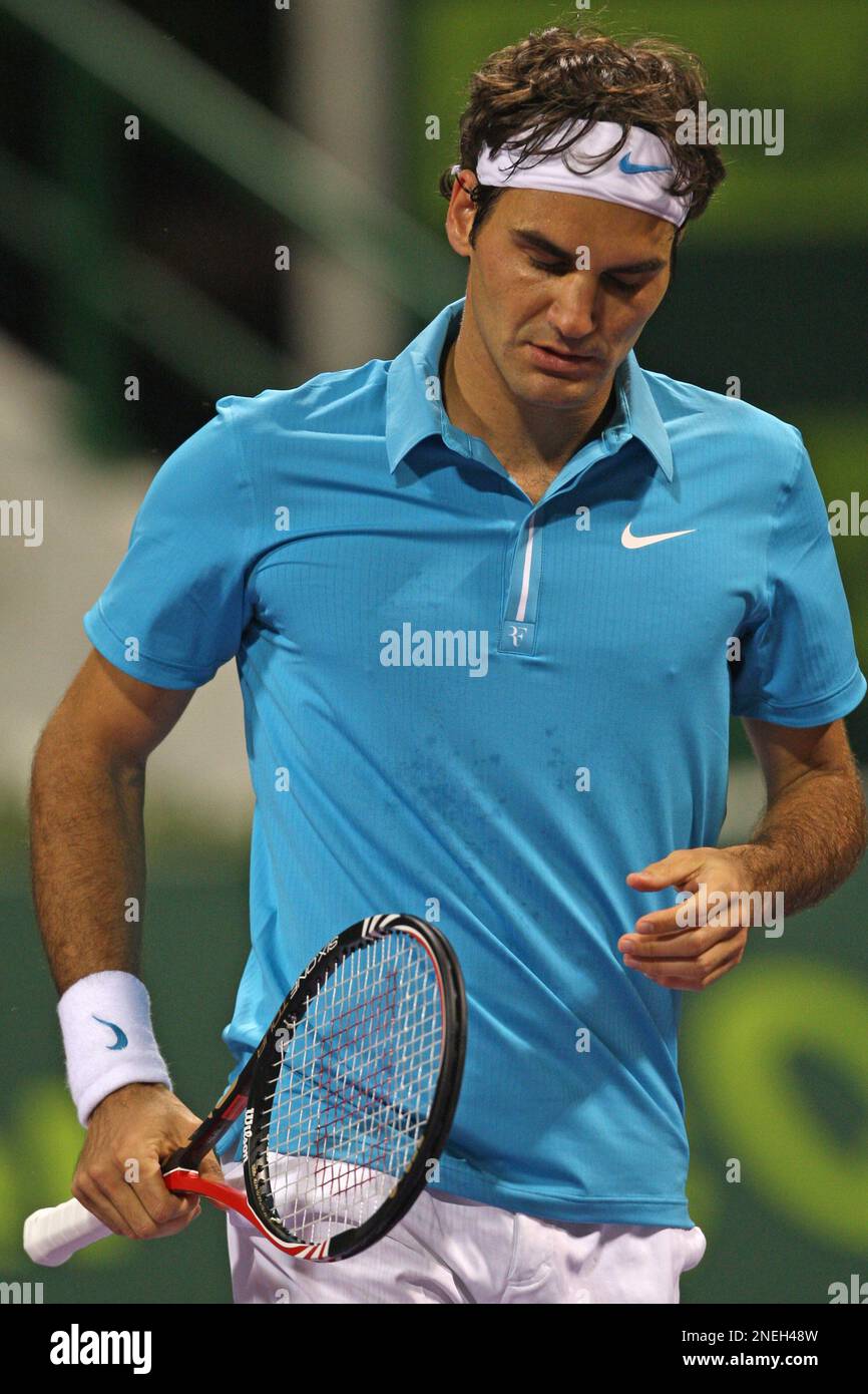 World number one tennis player Roger Federer, from Switzerland, reacts  after lost a point against Nikolay Davydenko of Russia during their  semifinal match at Qatar ATP Open Tennis tournament in Doha, Qatar,