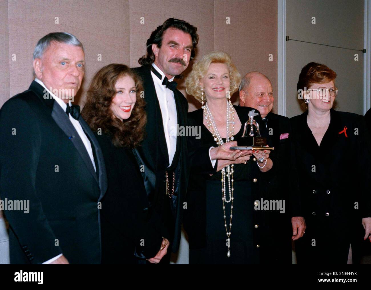 Frank Sinatra poses with his wife, Barbara, second from right, who was