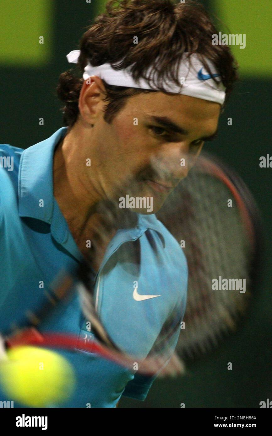 World number one tennis player Roger Federer from Switzerland returns ...