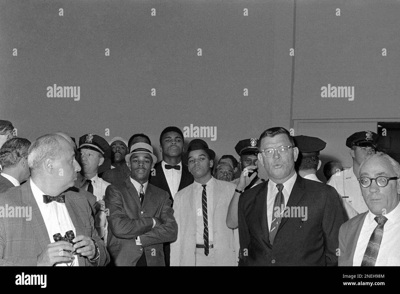 Challenger Cassius Clay Is Surrounded By Well Wishers And Handlers As