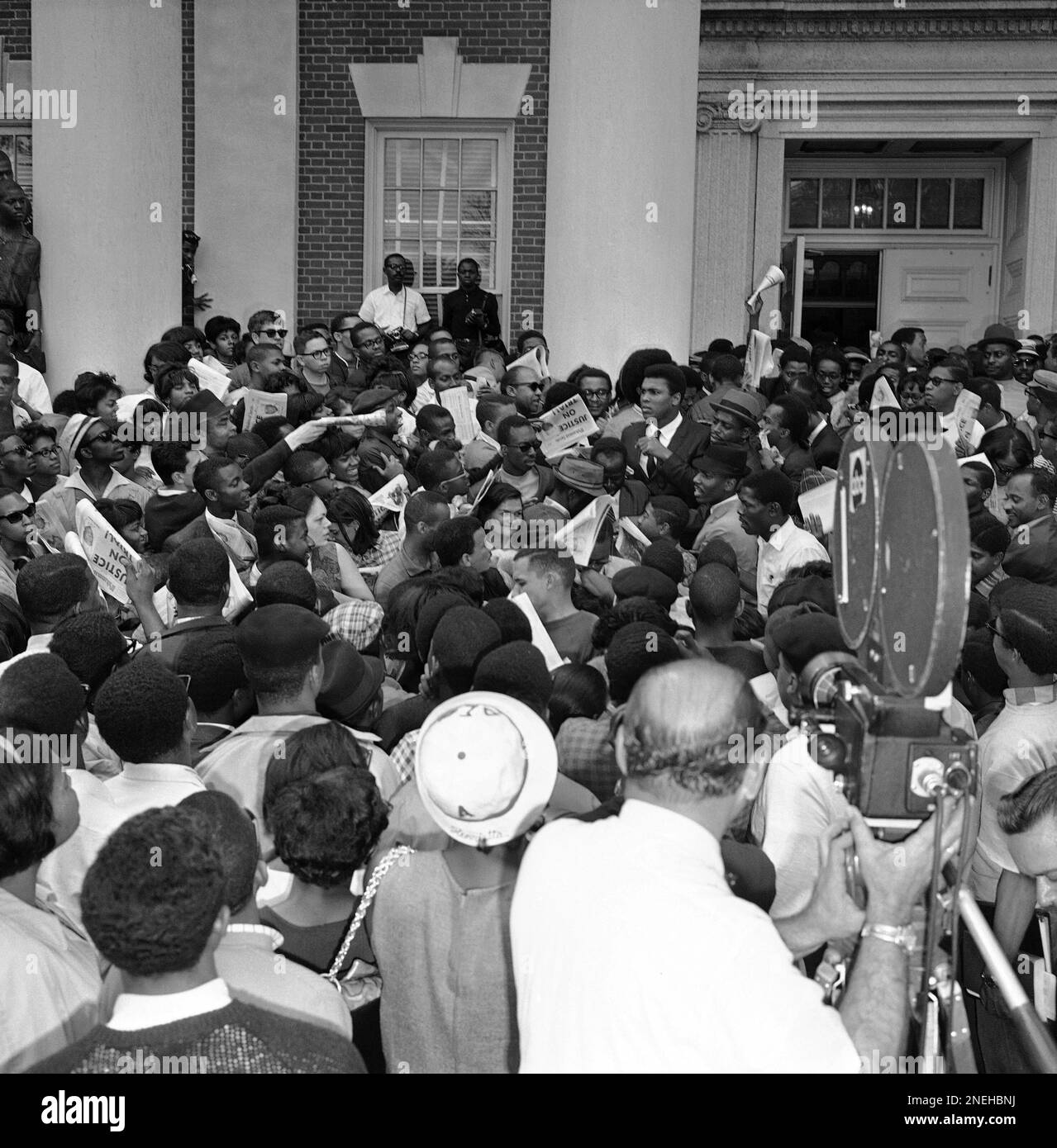 https://c8.alamy.com/comp/2NEHBNJ/heavyweight-boxing-champion-muhammad-ali-cassius-clay-displays-a-publication-titled-muhammad-speaks-as-he-addresses-a-rally-at-predominantly-black-howard-university-on-april-22-1967-in-washington-clay-who-prefers-to-be-called-muhammad-ali-faces-induction-in-the-army-on-april-28-but-he-says-hell-go-to-prison-before-he-serves-ap-photocharles-gorry-2NEHBNJ.jpg