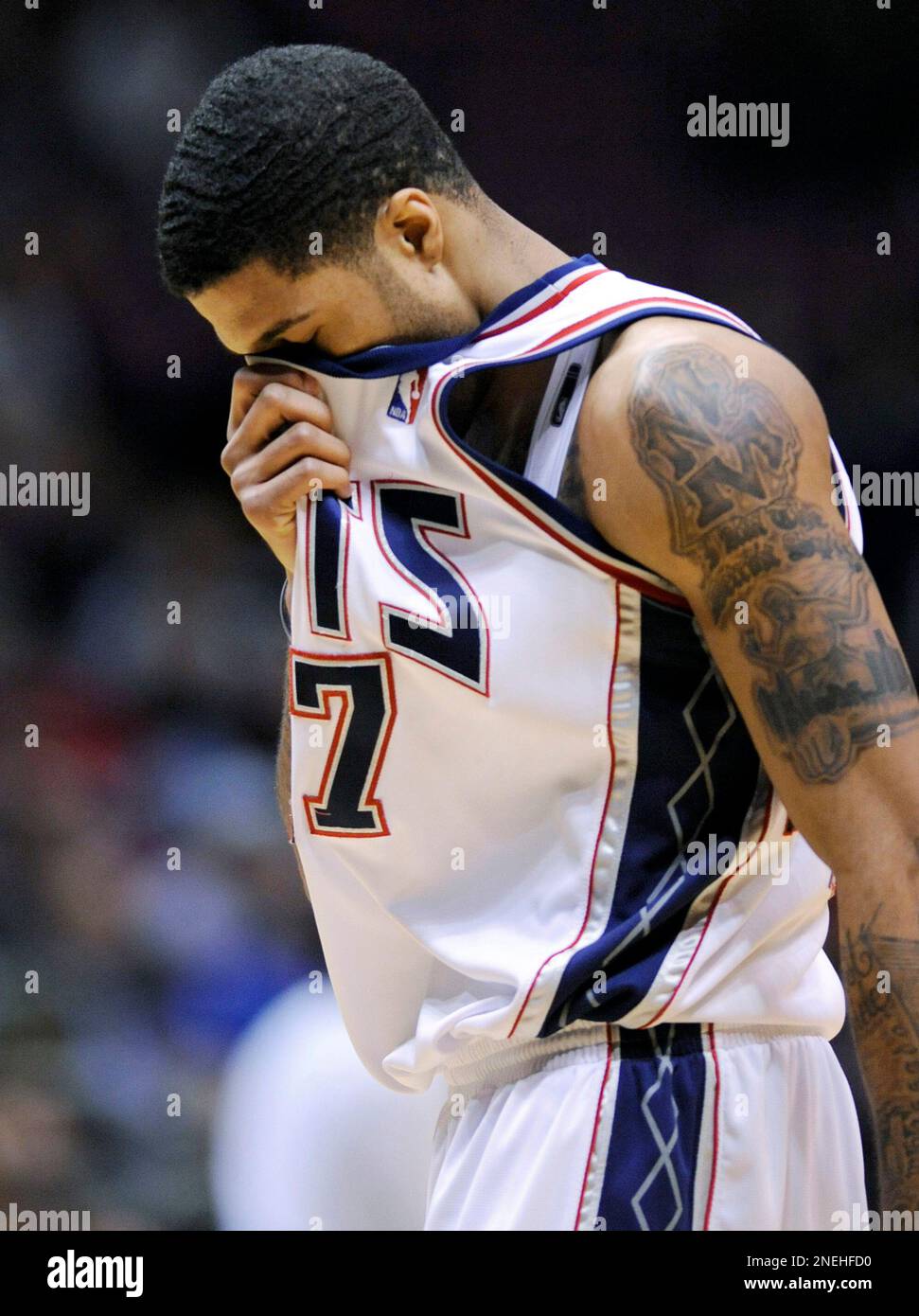 New Jersey Nets' Chris Douglas-Roberts reacts during the fourth quarter of  an NBA basketball game against the Milwaukee Bucks Tuesday, Jan. 5, 2010 in  East Rutherford, N.J. The Bucks beat the Nets, image size:971x1390