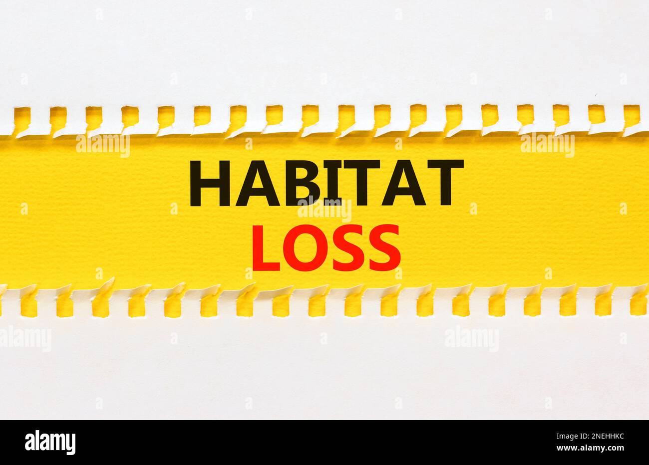 Habitat loss symbol. Concept words Habitat loss on yellow paper. Beautiful yellow table white