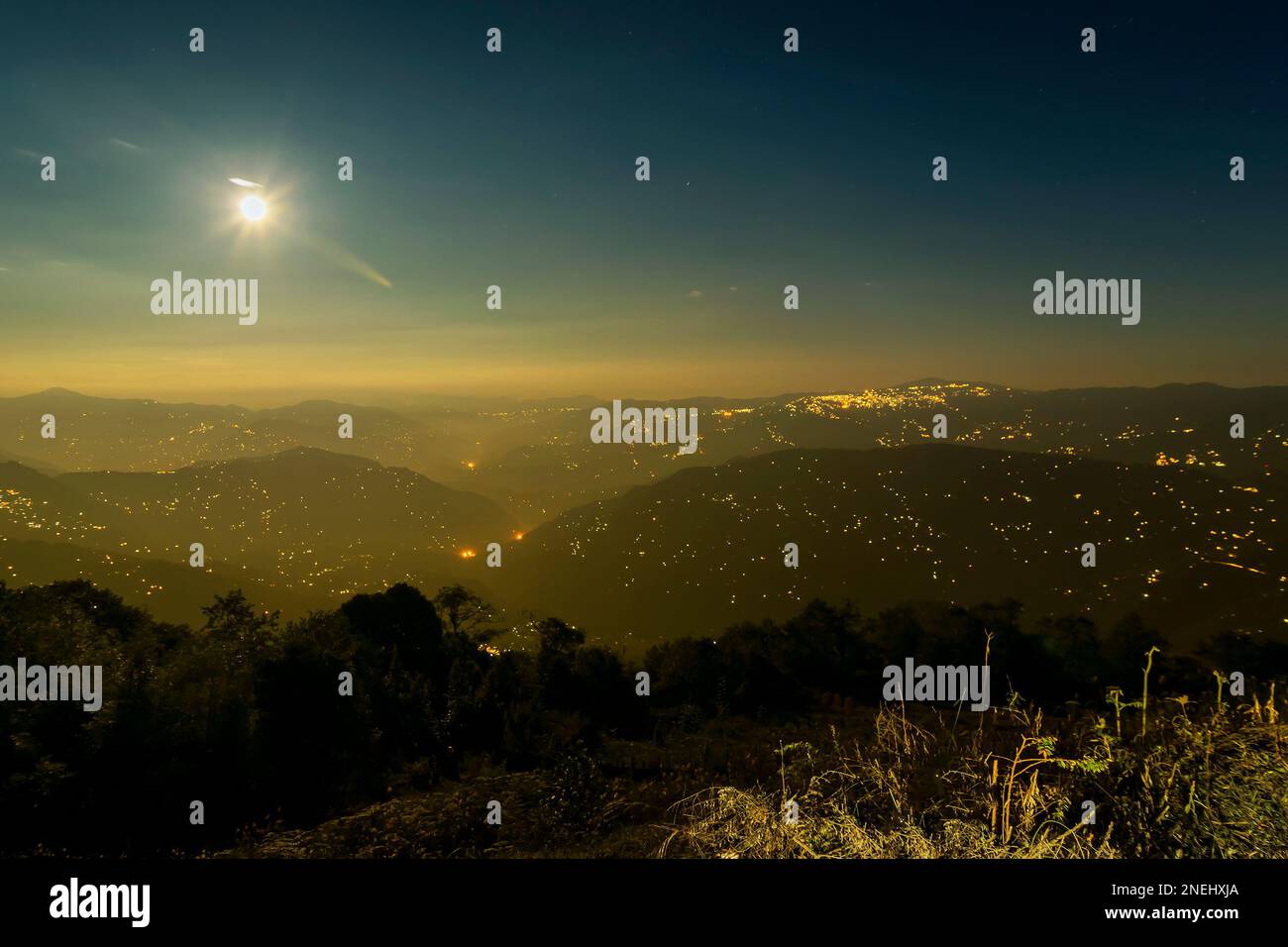 Pearls of light of Queen of Hills, Darjeeling town, at night at far