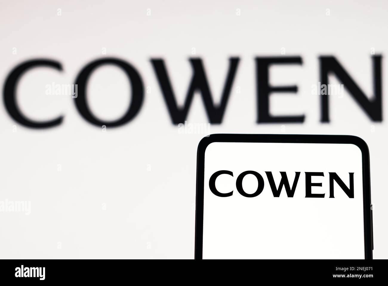 In this photo illustration the Cowen Inc. logo seen displayed on a