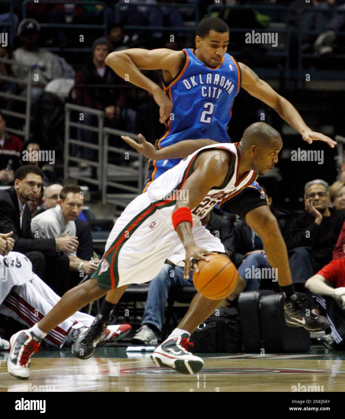 Milwaukee Bucks' Michael Redd (22) drives past Oklahoma City Thunder's Thabo Sefolosha (2) during the first half of an NBA basketball game Saturday, Jan. 2, 2010, in Milwaukee. (AP Photo/Morry Gash) Stock Photo