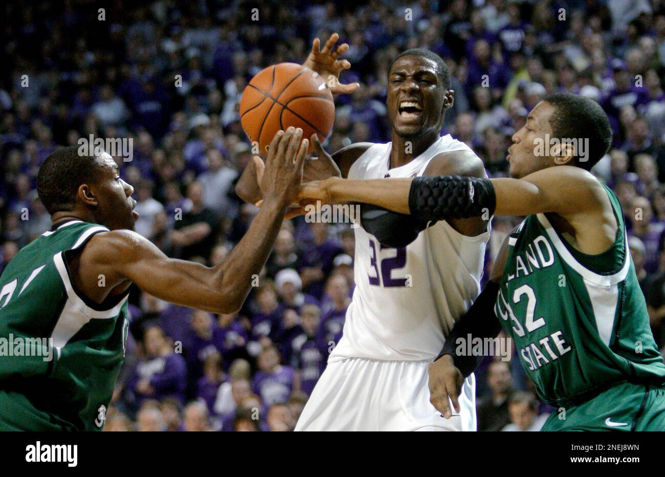 Kansas State's Jamar Samules, center, is pressured by Cleveland State's Norris  Cole, left, and D'aundray Brown, right, during the first half of an NCAA  college basketball game Tuesday, Dec. 29, 2009, in