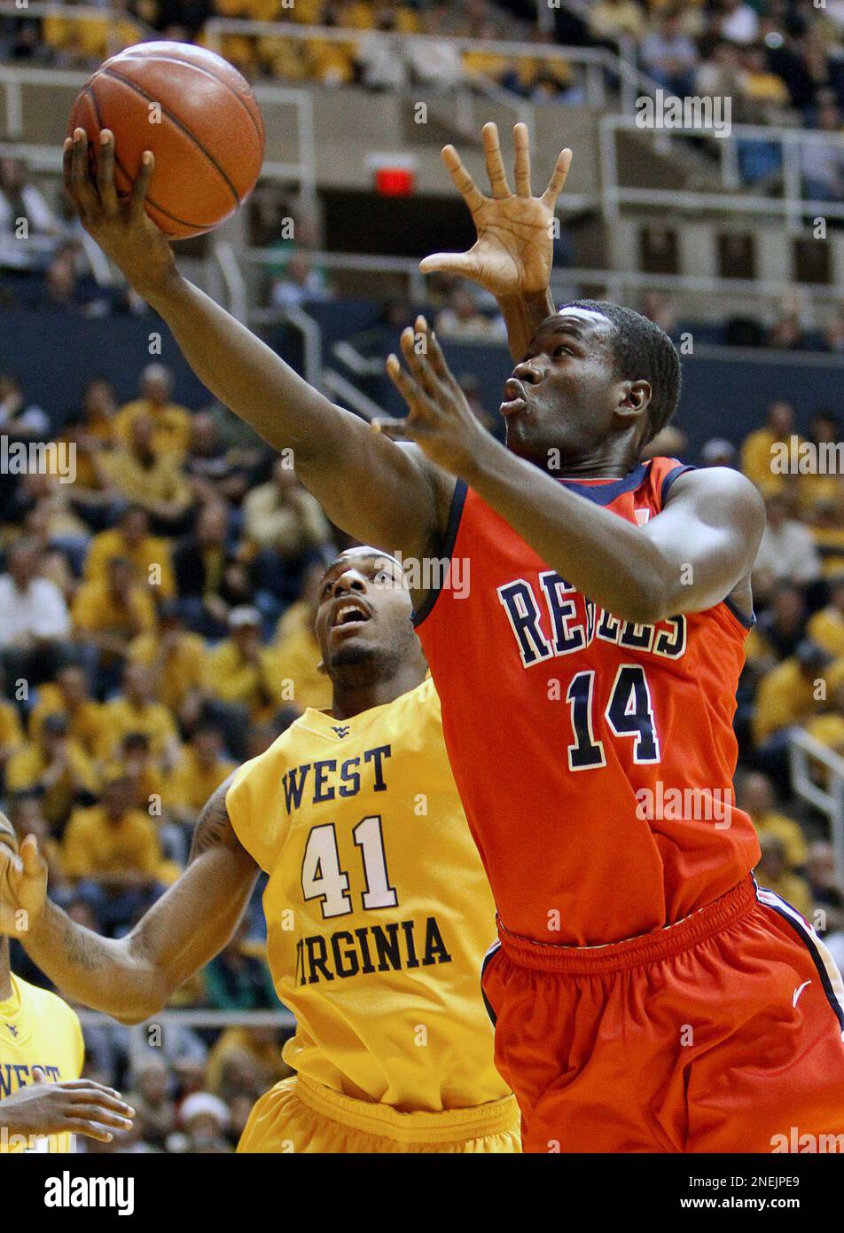 West Virginia's John Flowers (41) defends Mississippi's Eniel Polynice
