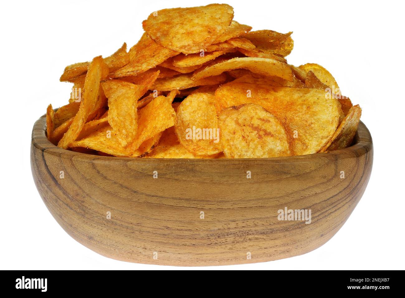 paprika flavored potato chips in a teakwood bowl isolated on white background Stock Photo