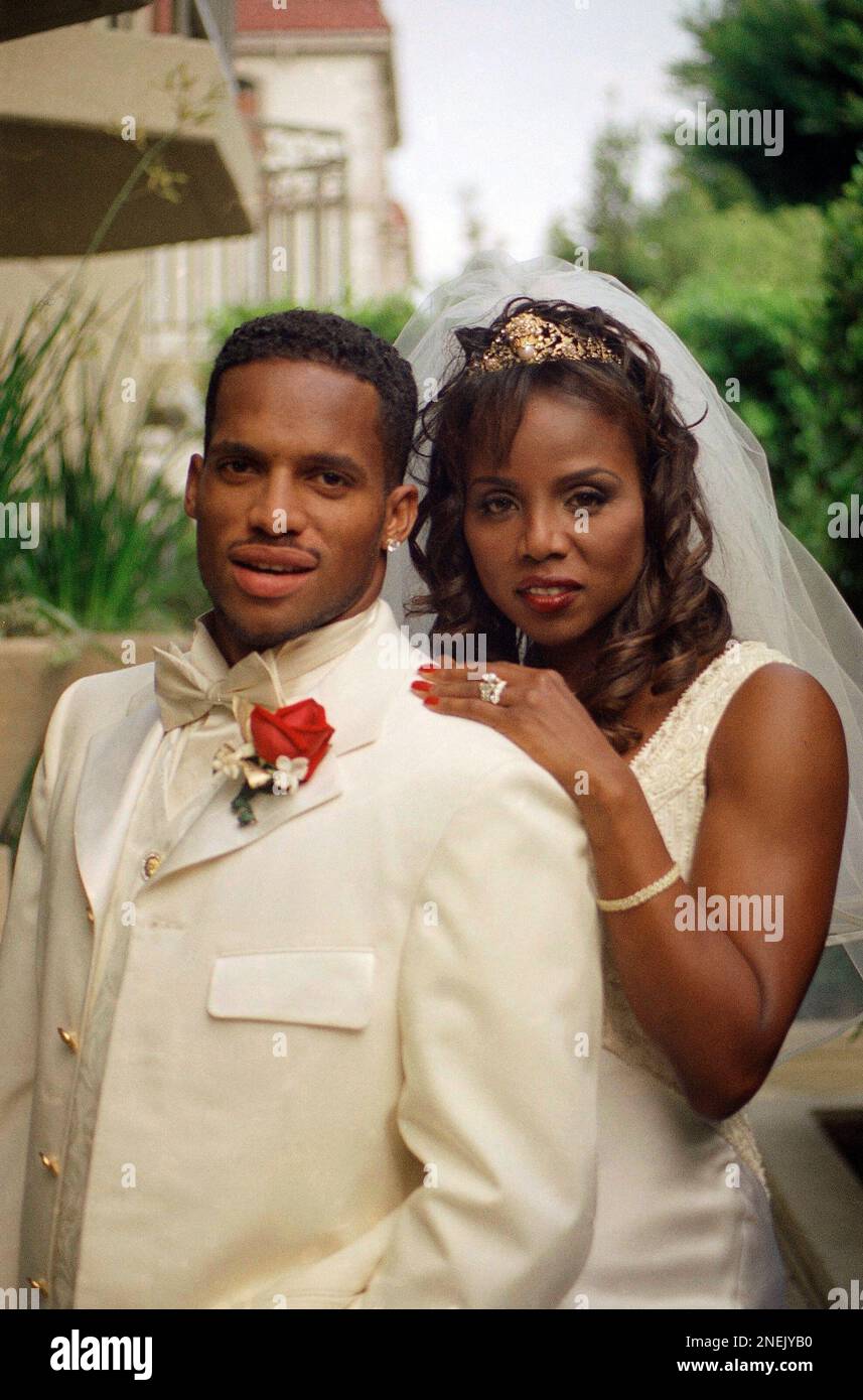 Ato Boldon and his new wife Cassandra Mills pause for a photo following