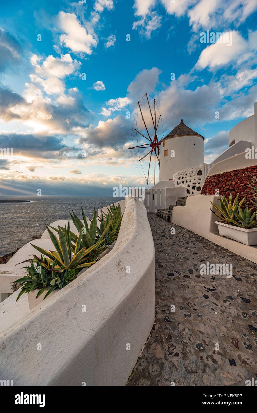 View of a traditional windmill at dusk, Santorini Stock Photo