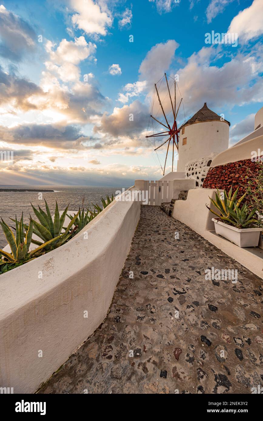 View of a traditional windmill at dusk, Santorini Stock Photo