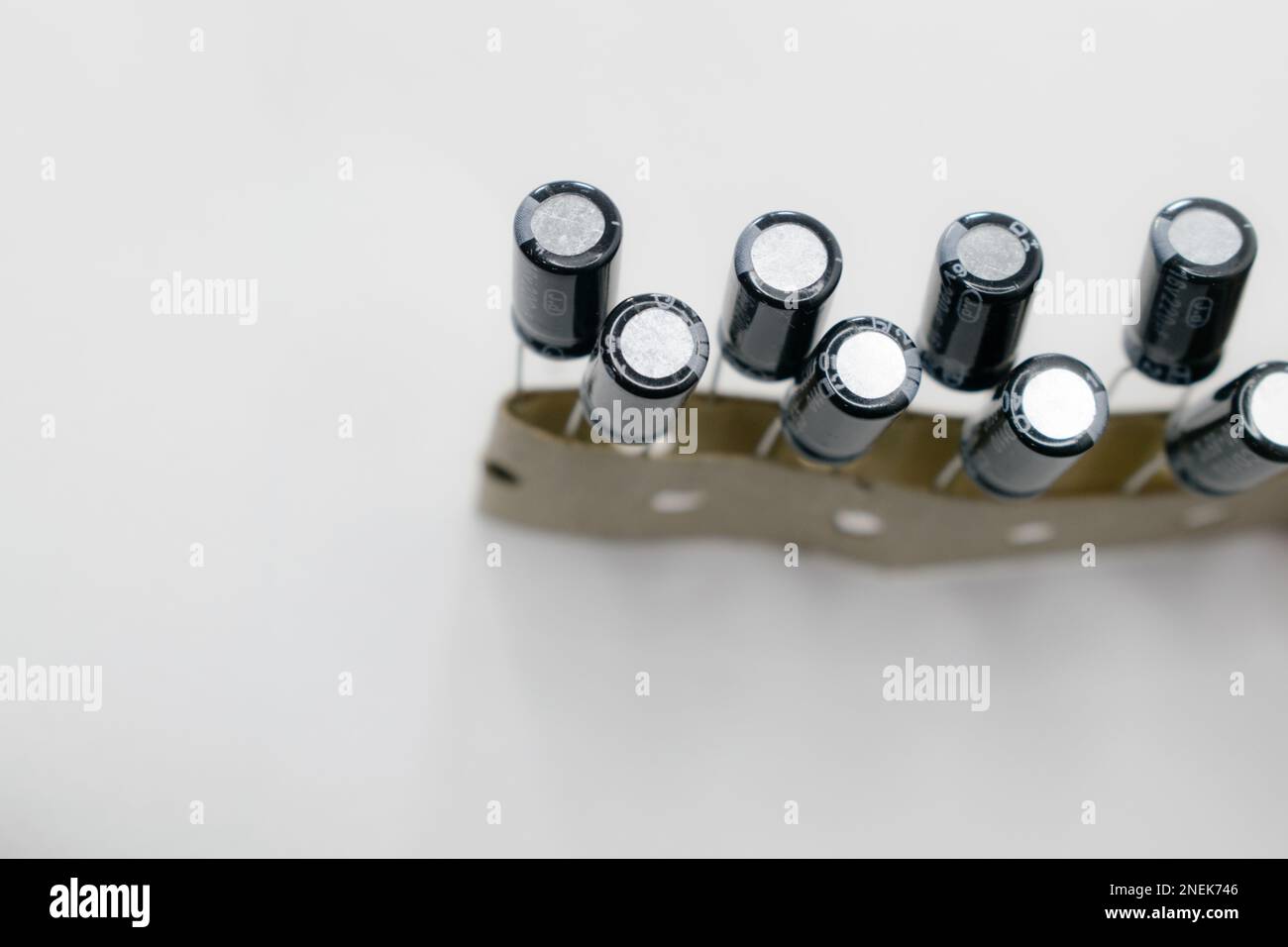 Multiple capacitors isolated on a white background. Capacitors are used