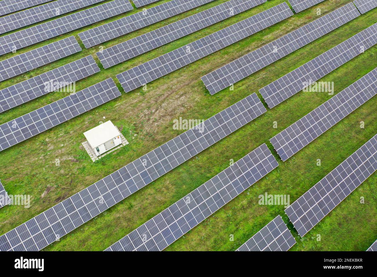 Aerial view of the solar power plant from above. Converting solar energy into electricity from large solar panels. Solar panels in Europe, Hungary. Stock Photo