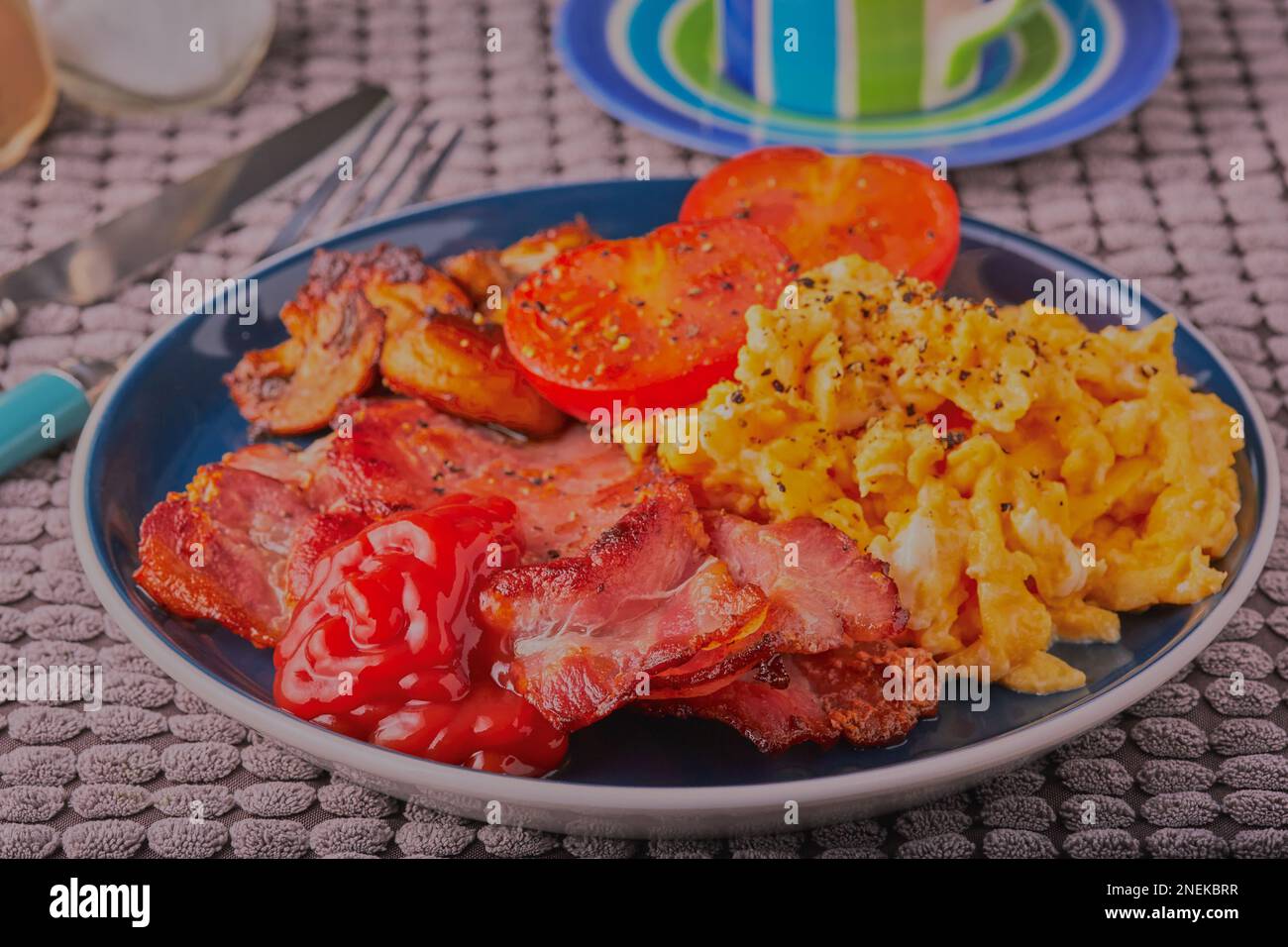 Cooked English breakfast with lashings of tomato sauce Stock Photo Alamy