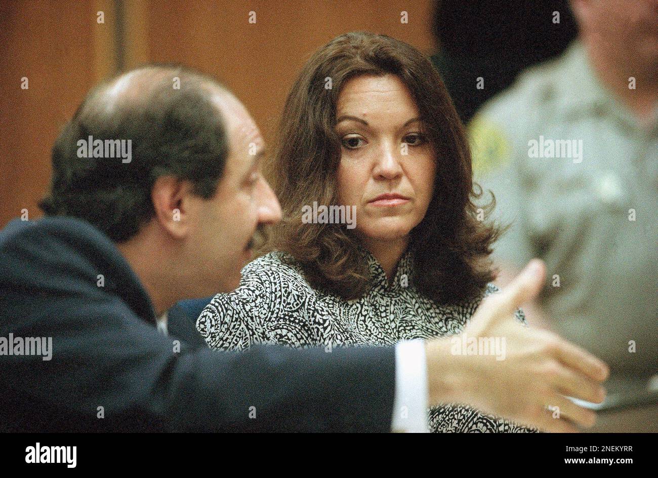 Whitewater figure Susan McDougal, right, looks at her attorney Mark ...