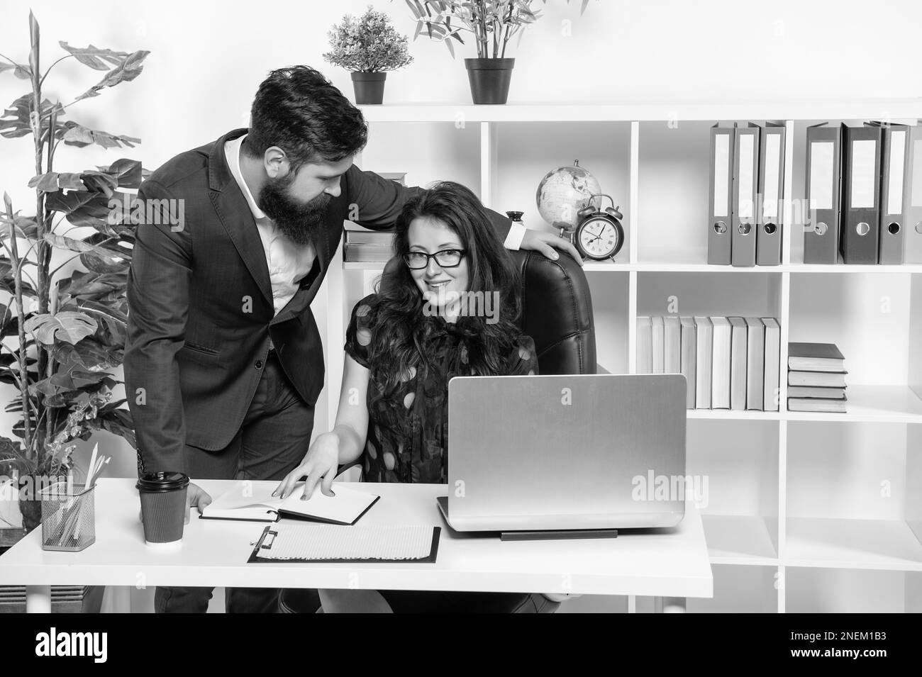 Good colleagues. Male and female colleagues work together. Co-workers in office. Office employees Stock Photo