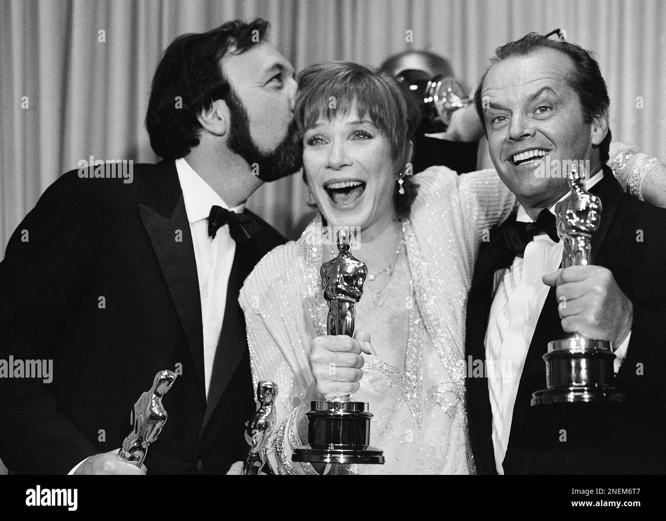 Director James Brooks, left, gives actress Shirley MacLaine a