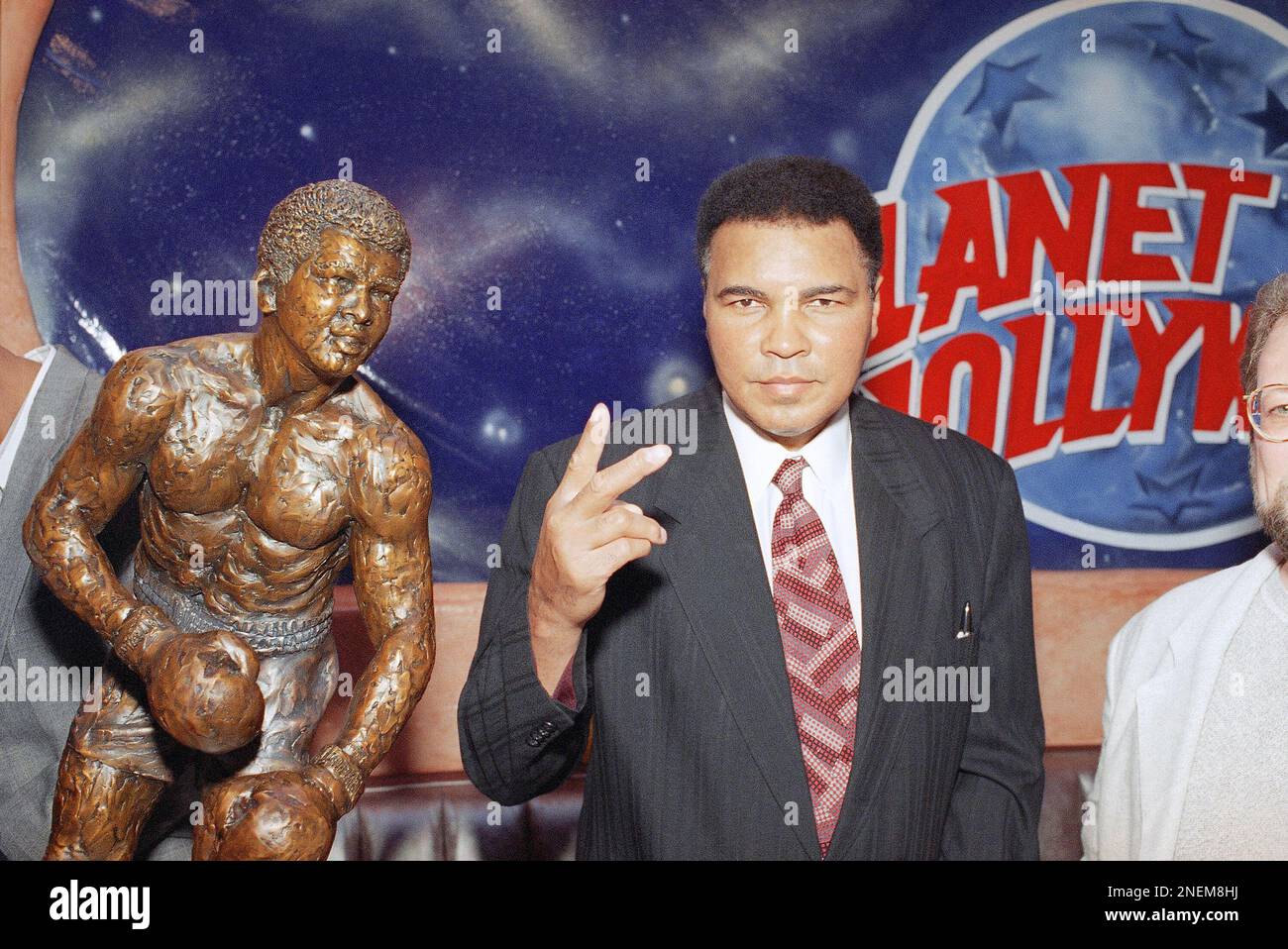Muhammad Ali, one of the world?s greatest sports heroes, jestures