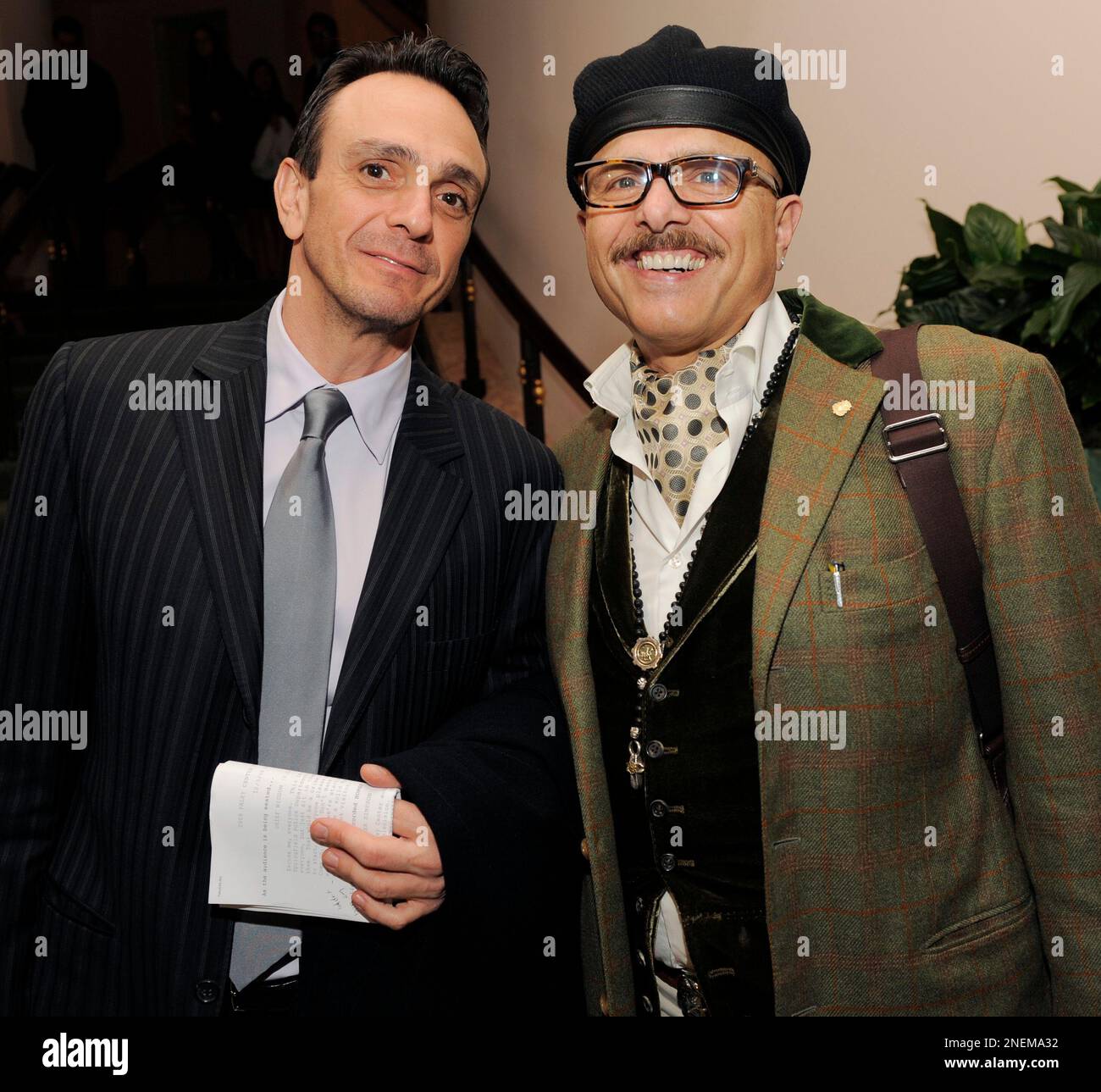 Hank Azaria, left, a voice artist on the animated series "The Simpsons," poses with actor Joe Pantoliano at a gala to honor the show by The Paley Center for Media, Tuesday, Dec. 8, 2009 in Beverly Hills, Calif. (AP Photo/Chris Pizzello) Stock Photo