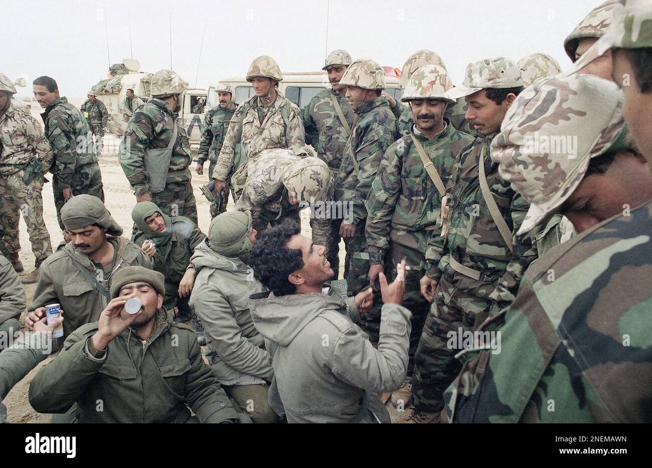 Iraqi prisoners eat, drink and smoke cigarettes from Egyptian soldiers? rations 40km from the