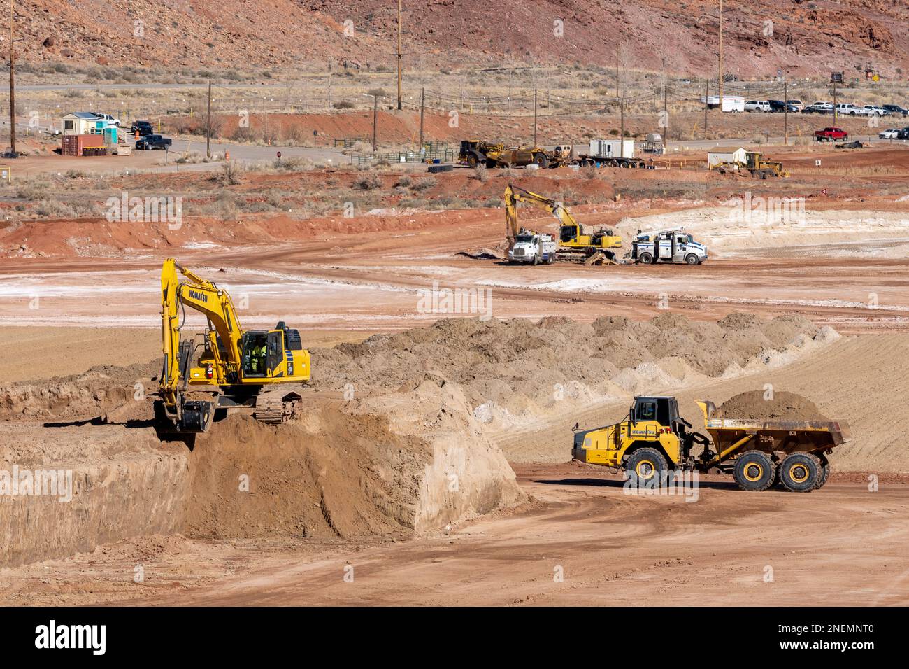 A heavy duty excavator works at the hazardous uranium tailings at the