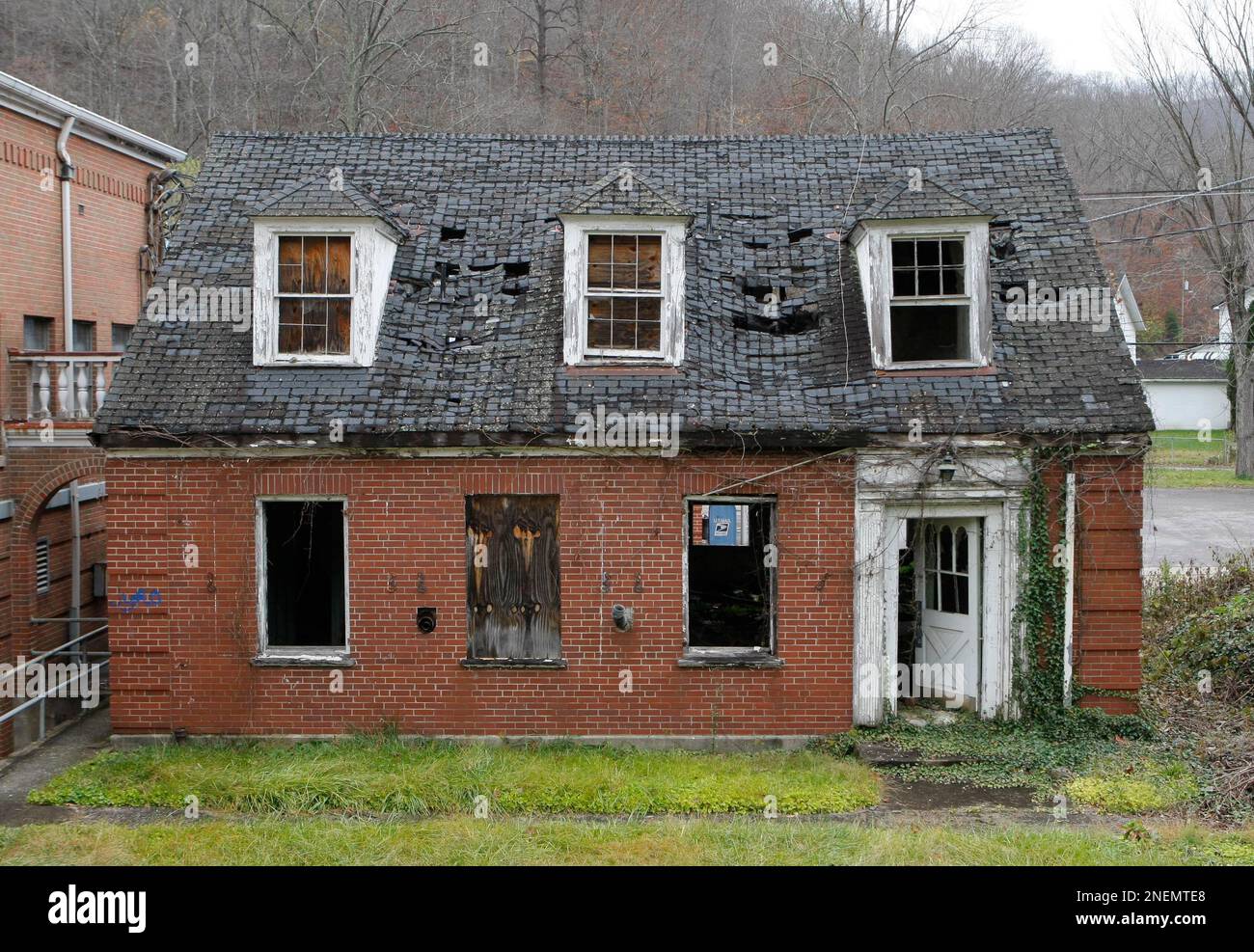 Broken windows and a collapsing roof are seen on the former library in