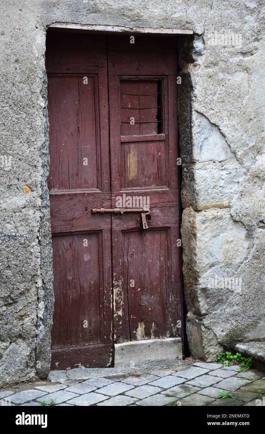 Old wooden door of a house in rural areas of Italy Stock Photo - Alamy