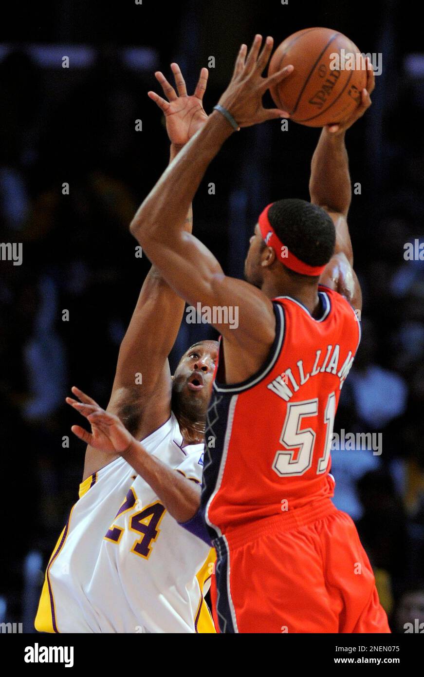 New Jersey Nets forward Sean Williams, right, shoots as Los Angeles Lakers  guard Kobe Bryant defends during the first half of their NBA basketball  game, Sunday, Nov. 29, 2009, in Los Angeles. (