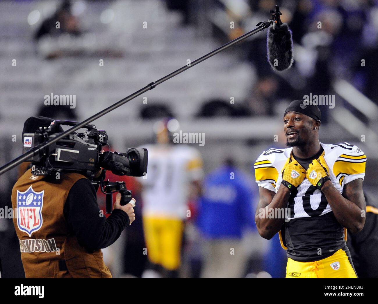 FILE - In this Feb. 1, 2009 file photo, Pittsburgh Steelers wide receiver  Santonio Holmes (10) makes a touchdown reception against Arizona Cardinals  safety Aaron Francisco (47) during the fourth quarter of