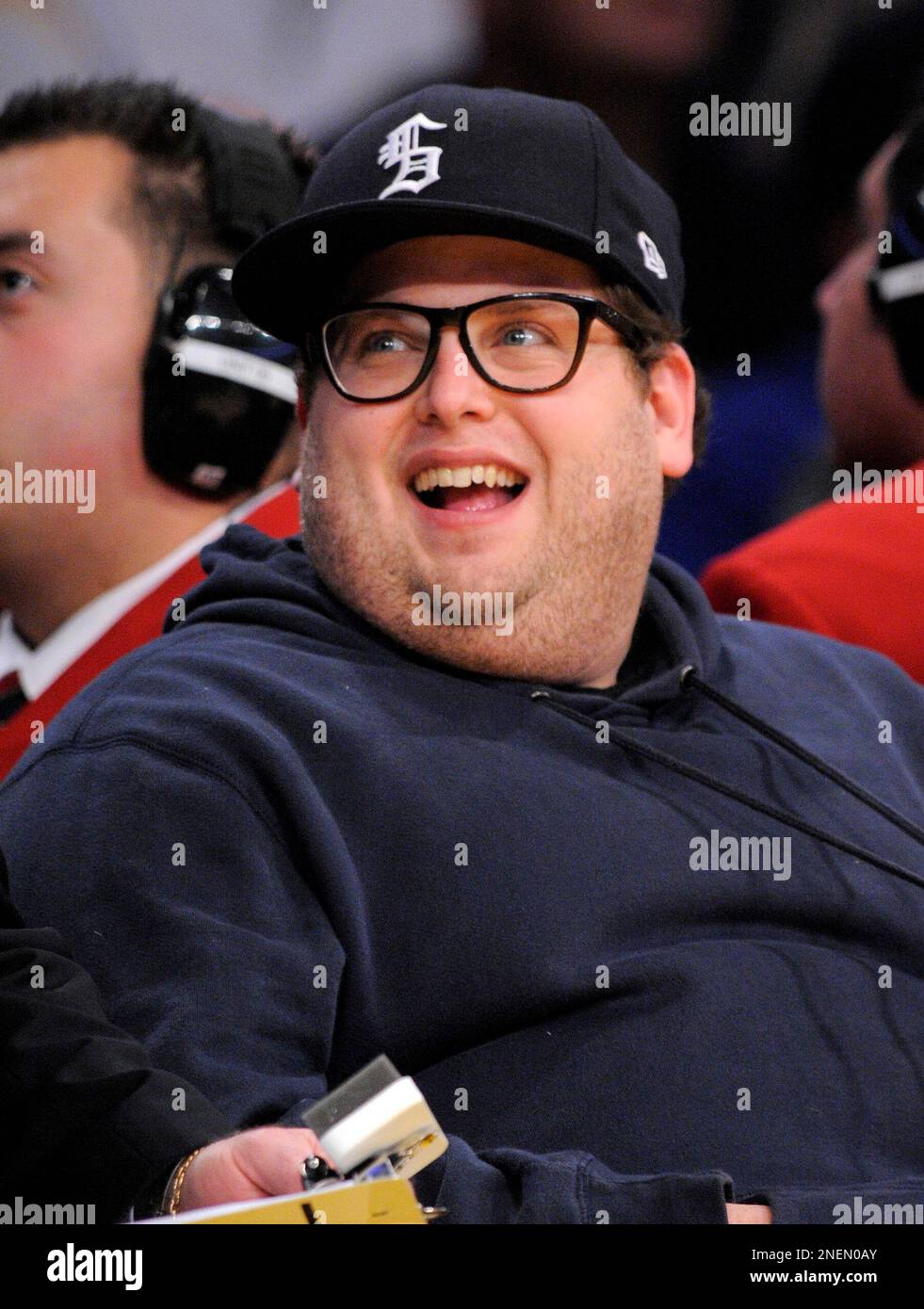 Actor Jonah Hill watches the Los Angeles Lakers play the New Jersey Nets  during the second half of their NBA basketball game, Sunday, Nov. 29, 2009,  in Los Angeles. The Lakers won