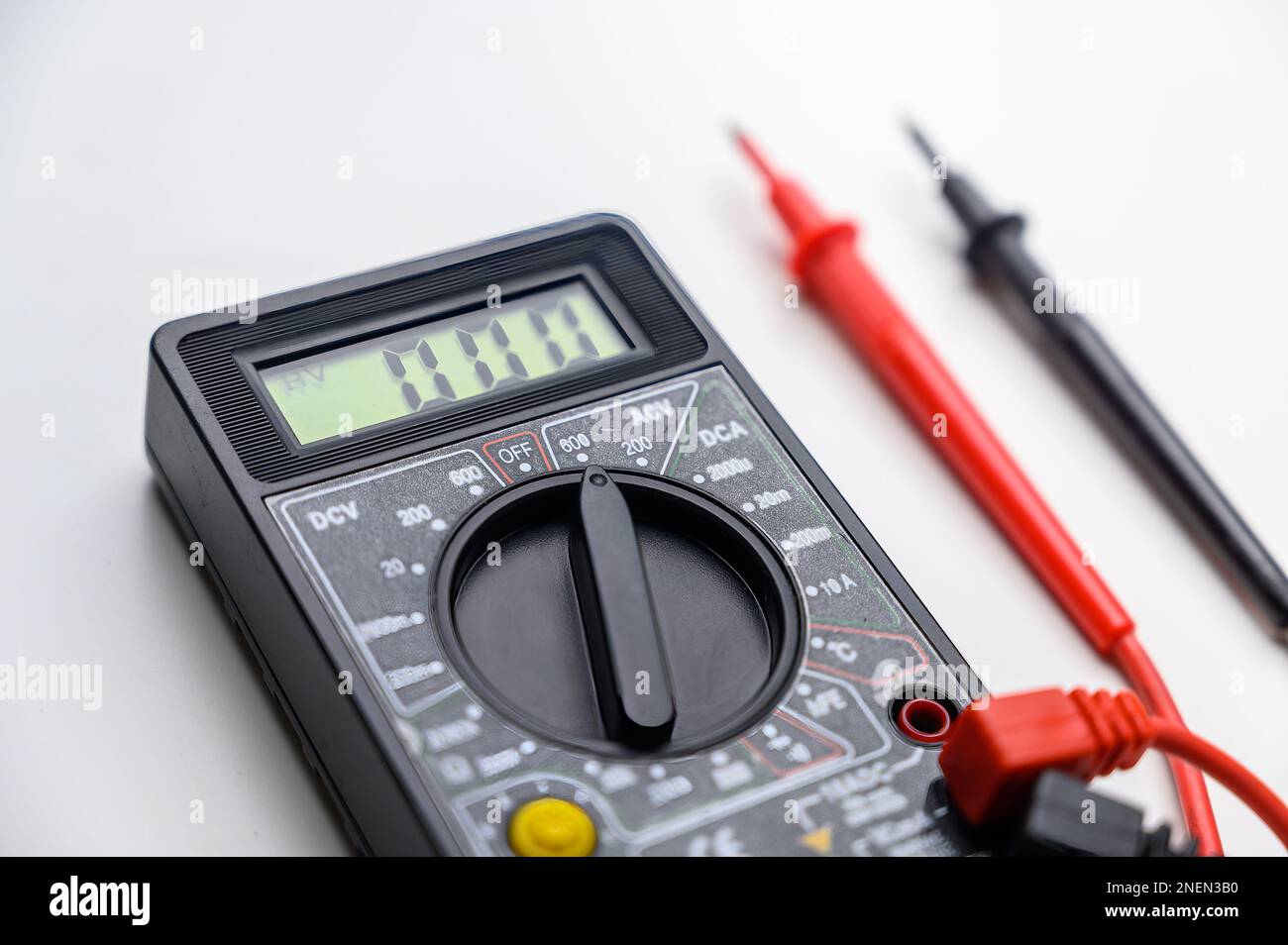 Digital multimeter on a white background. Tool for testing electrical