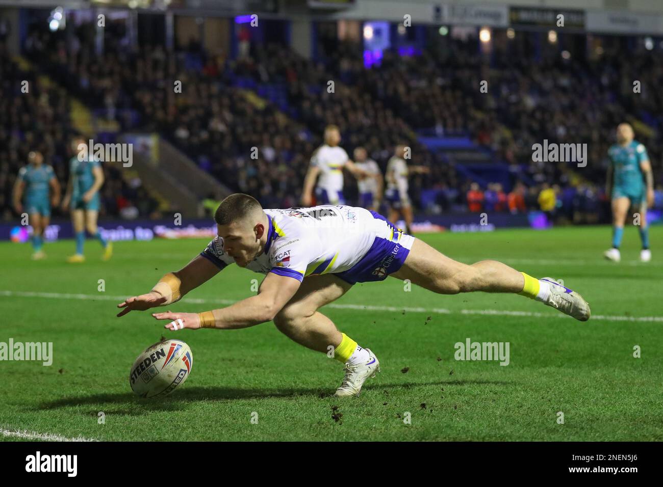 Danny Walker 16 of Warrington Wolves goes over for a try to make it 22