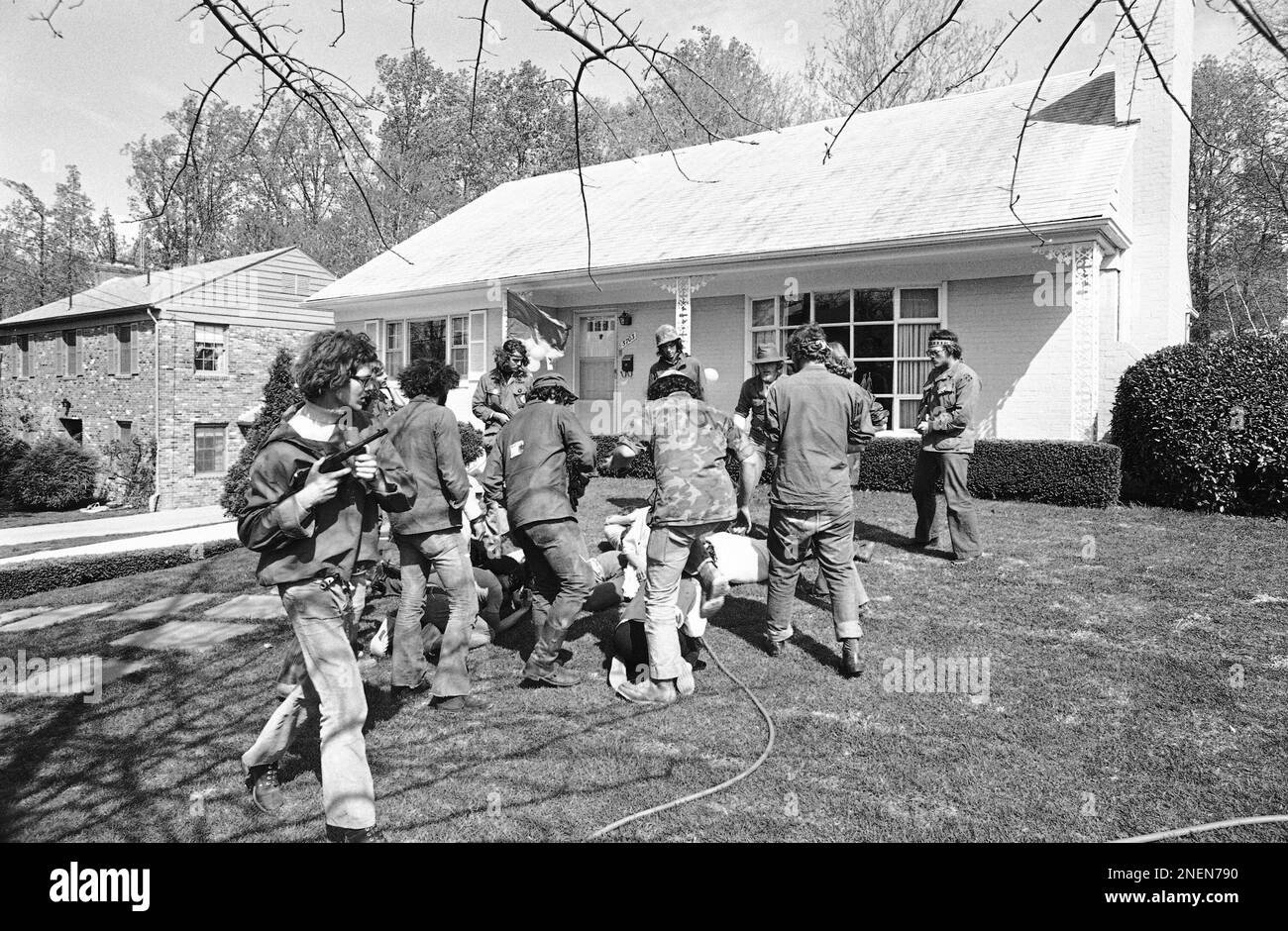 Antiwar demonstrators stage a mock battle on the lawn of Defense