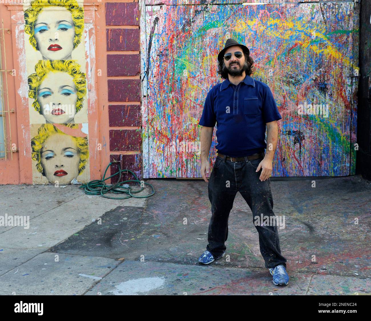 Artist Mr. Brainwash, aka Thierry Guetta, poses outside his studio in Los Angeles, Monday, Nov