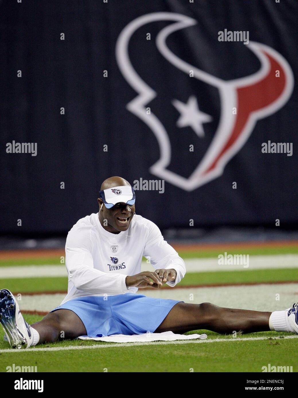 Tennessee Titans linebacker Keith Bulluck stretches before their NFL