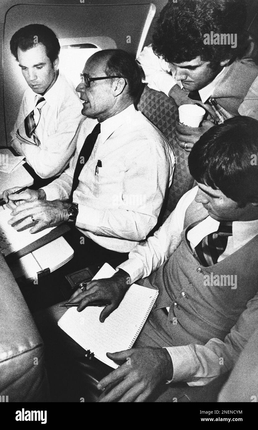 Dallas Cowboys coach Tom Landry (2nd from left) talks to all his