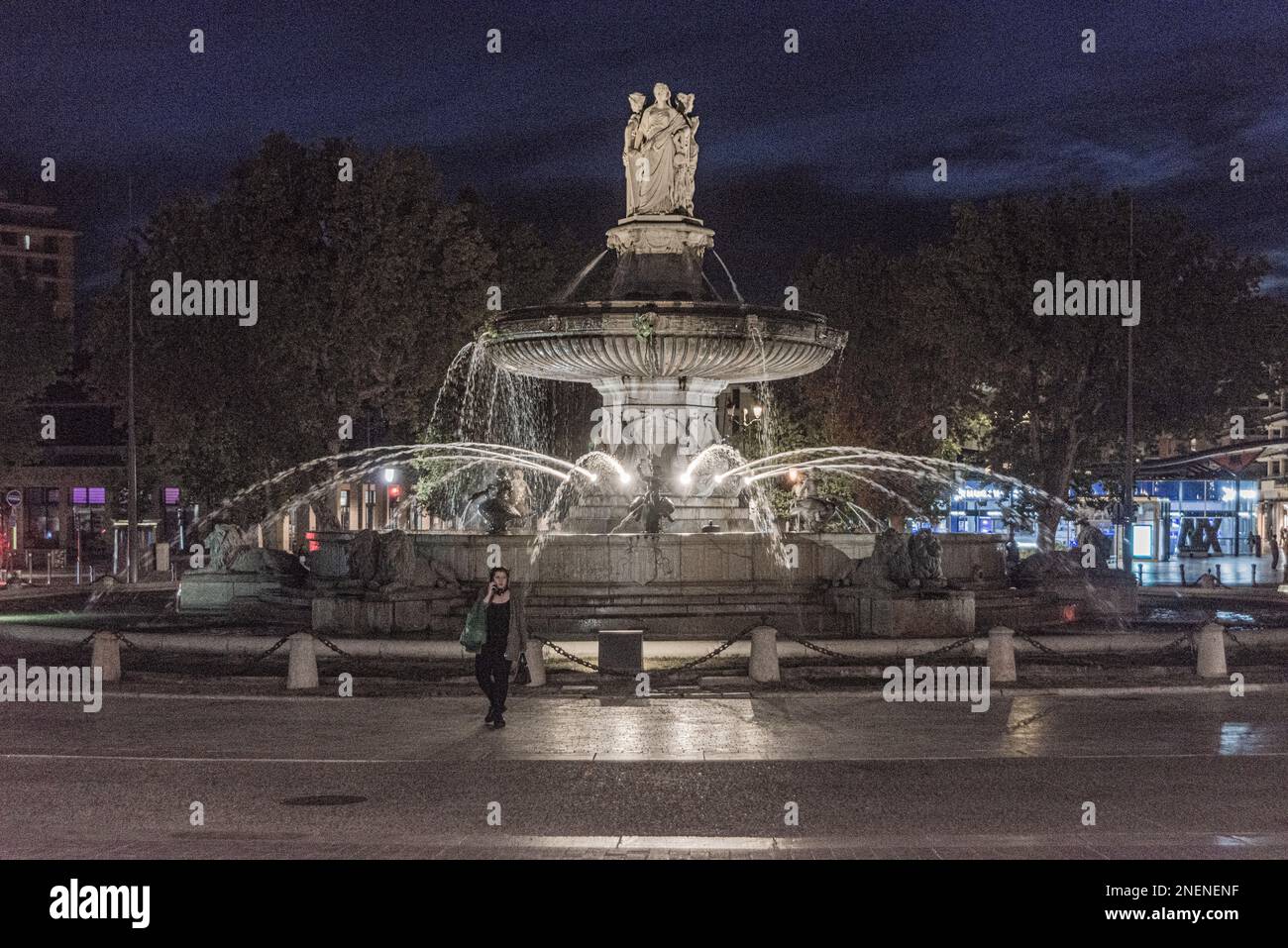 Fountain at Place de La Rotonde in Aux-in-Provence at night Stock Photo ...