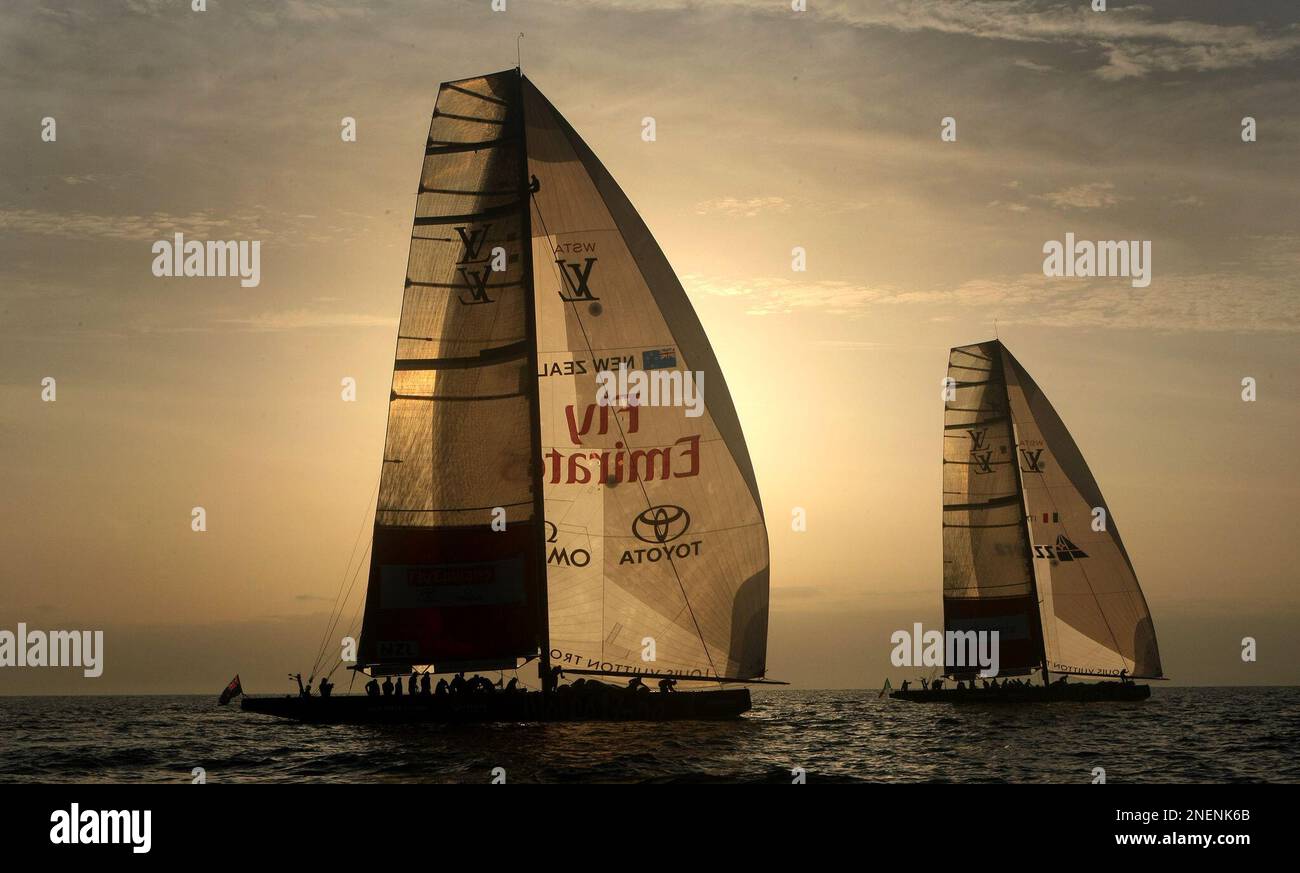 The Italian team Azzurra, right, and the Emirates Team New Zealand sail ...