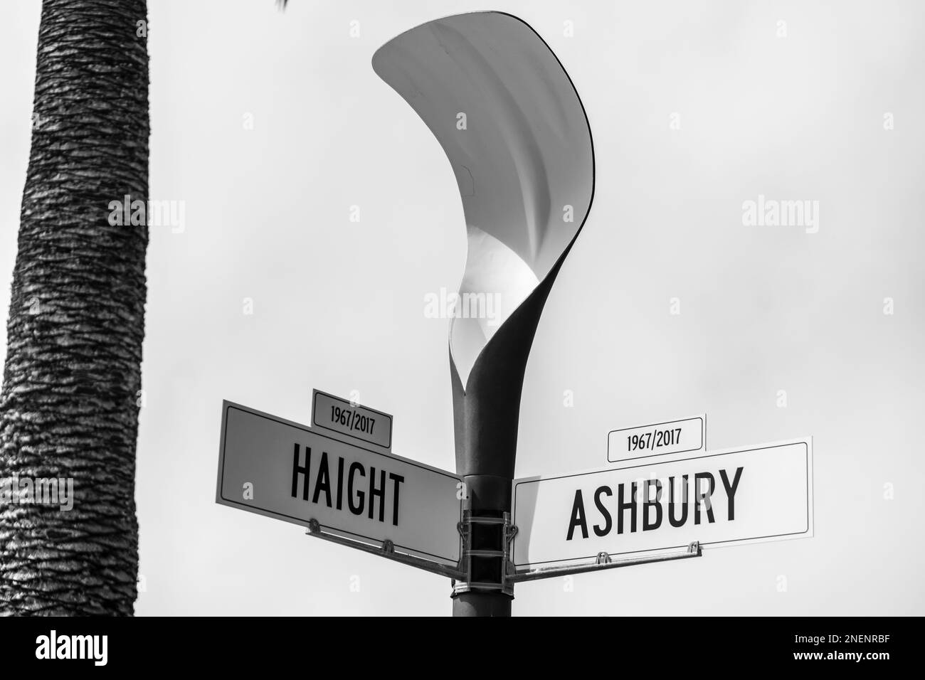 A grayscale of street signs of Haight in 19672017 and Ashbury in 1967