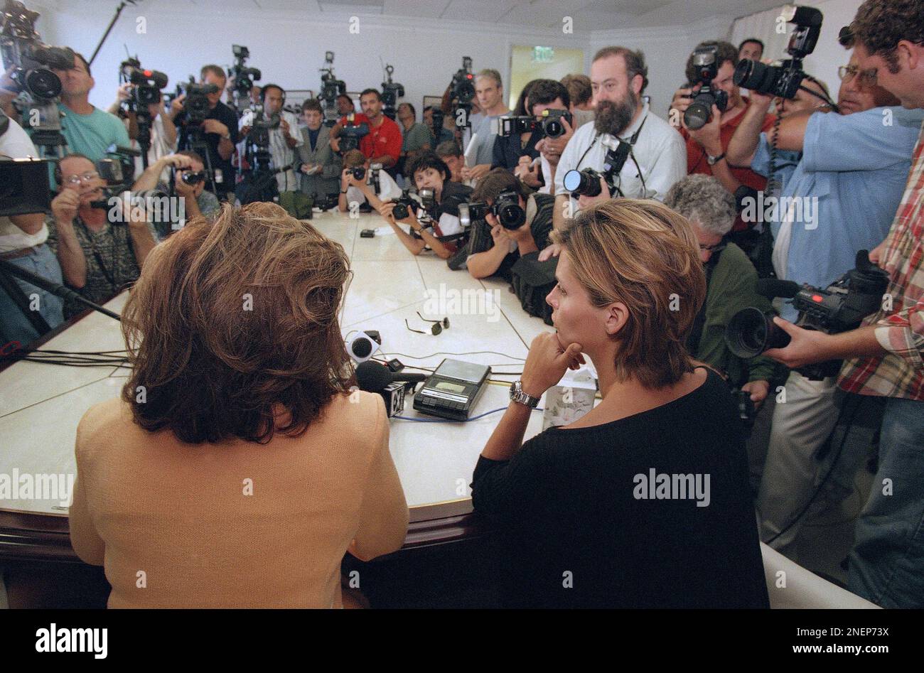 Model Kelly Fisher, right, and her attorney, Gloria Allred, face the