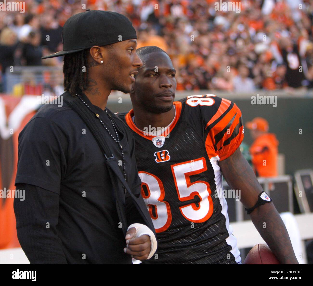 Cincinnati Bengals wide receivers Chris Henry left and Chad Ochocinco right talk during the second half of an NFL football game Sunday Nov. 8 2009 in Cincinnati. AP Photo David Kohl Stock Photo